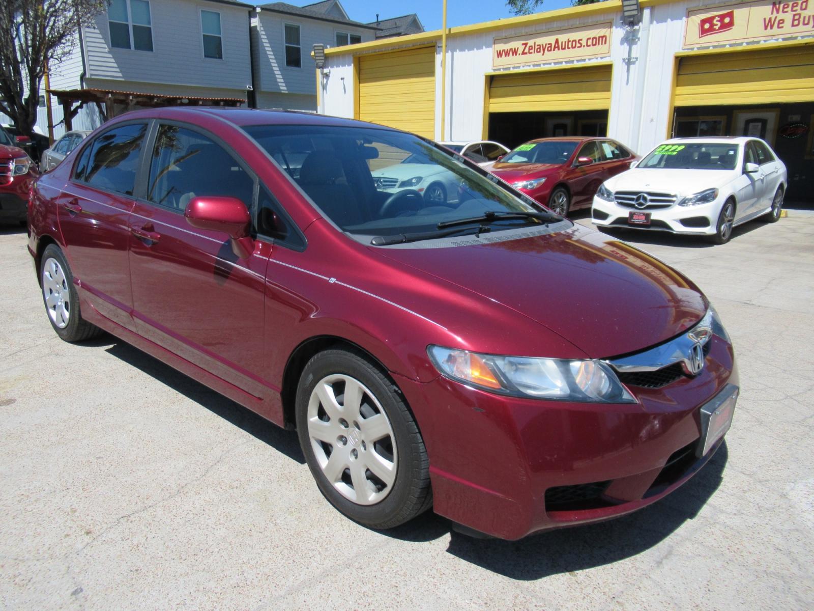 2009 Red /Tan Honda Civic LX Sedan AT (19XFA16529E) with an 1.8L L4 SOHC 16V engine, Automatic Overdrive transmission, located at 1511 North Shepherd Dr., Houston, TX, 77008, (281) 657-1221, 29.798361, -95.412560 - 2009 HONDA CIVIC LX VIN: 19XFA16529E042917 1 9 X F A 1 6 5 2 9 E 0 4 2 9 1 7 SEDAN 4 DR 1.8L I4 F SOHC 16V GASOLINE FRONT WHEEL DRIVE - Photo #18